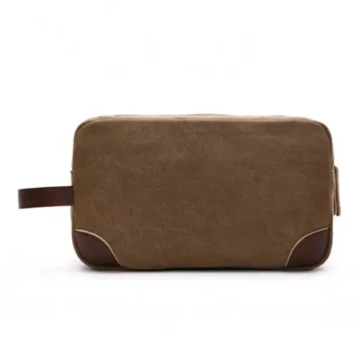 Large capacity interior of a men's dopp kit with waterproof lining for shaving sets and toiletries.